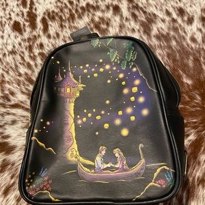 Disney bag, Brand new with Tags, never used. It even lights up for the kids